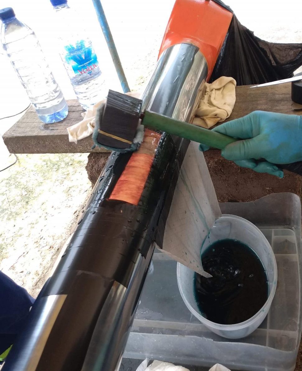 GASAQUIC technician brush-plating a hydraulic cylinder rod to restore its surface