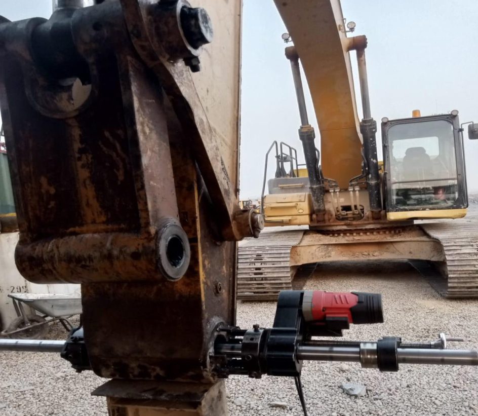 Excavator stick arm being repaired