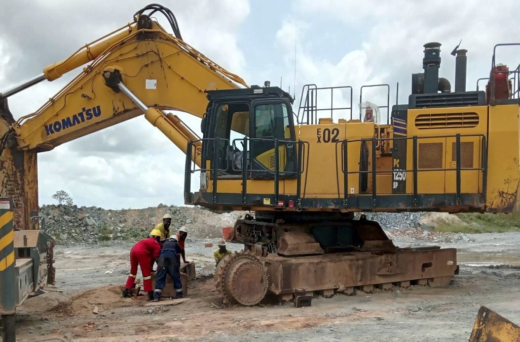 GASAQUIC technicians servicing a Komatsu mining excavator on a West African quarry site